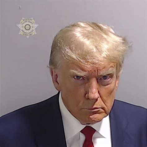 Mug shot of Donald Trump during speedy booking at Atlanta jail shows scowling former president